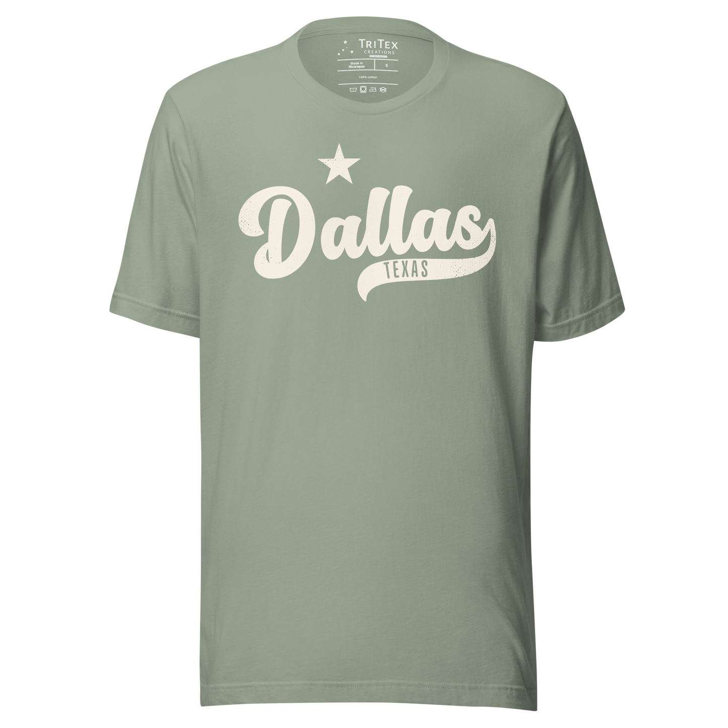 A sage green vintage-style t-shirt featuring a star with the words "Dallas TEXAS".