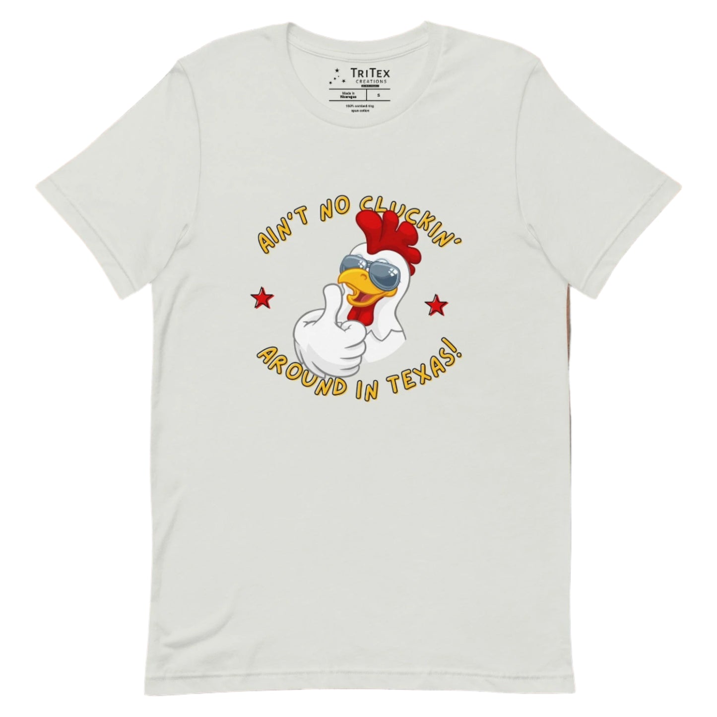 A silver t-shirt featuring an image of a chicken in sunglasses with the words "Ain't no cluckin' Texas". around in Texas!".