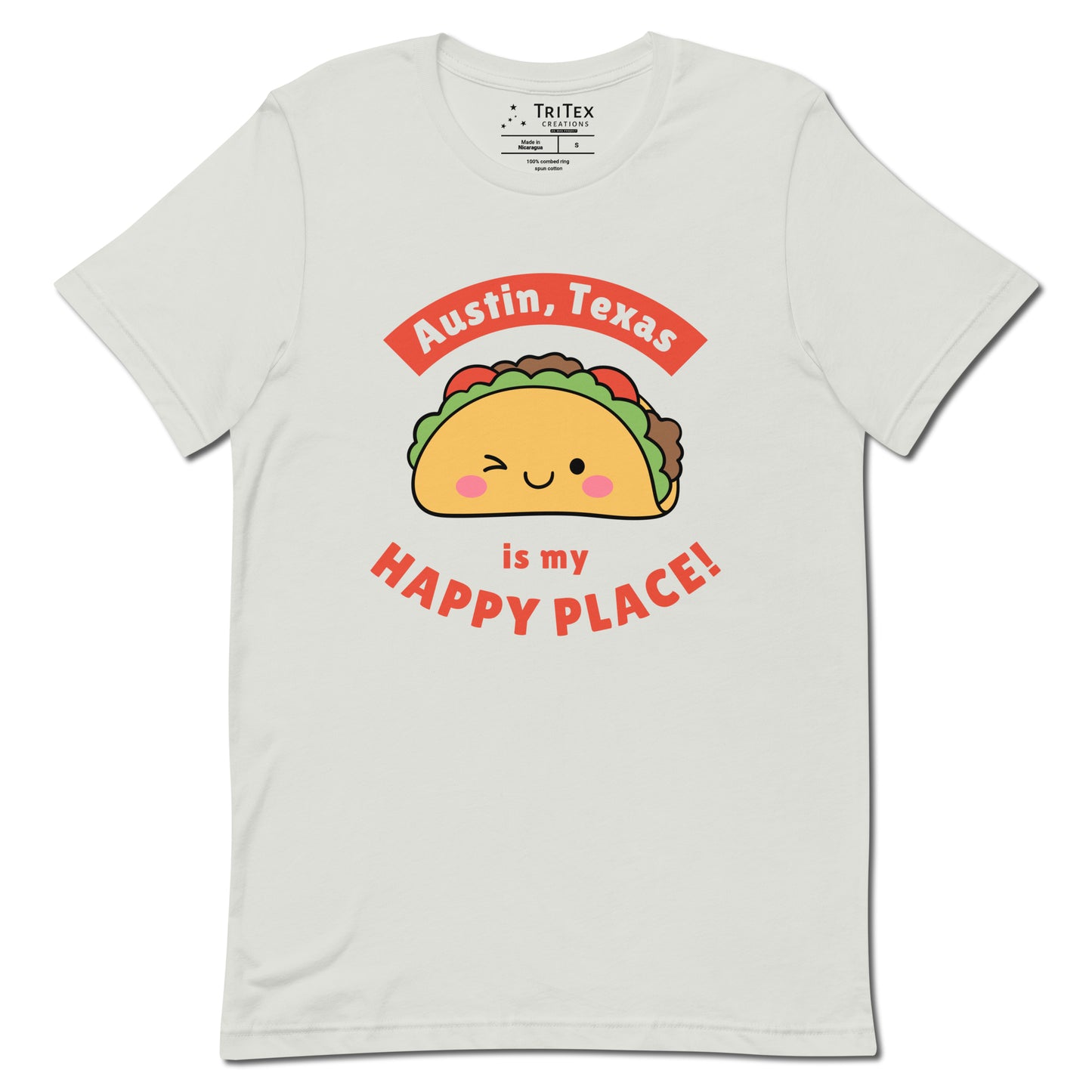 A silver t-shirt featuring a smiling, winking cartoon taco with the words "Austin, Texas is my happy place!".