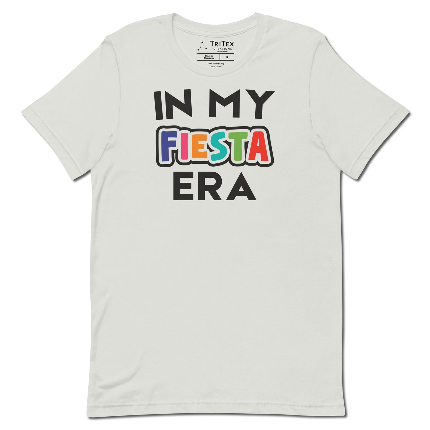 A silver t-shirt that reads "In My Fiesta Era" with Fiesta in Southwestern colors.