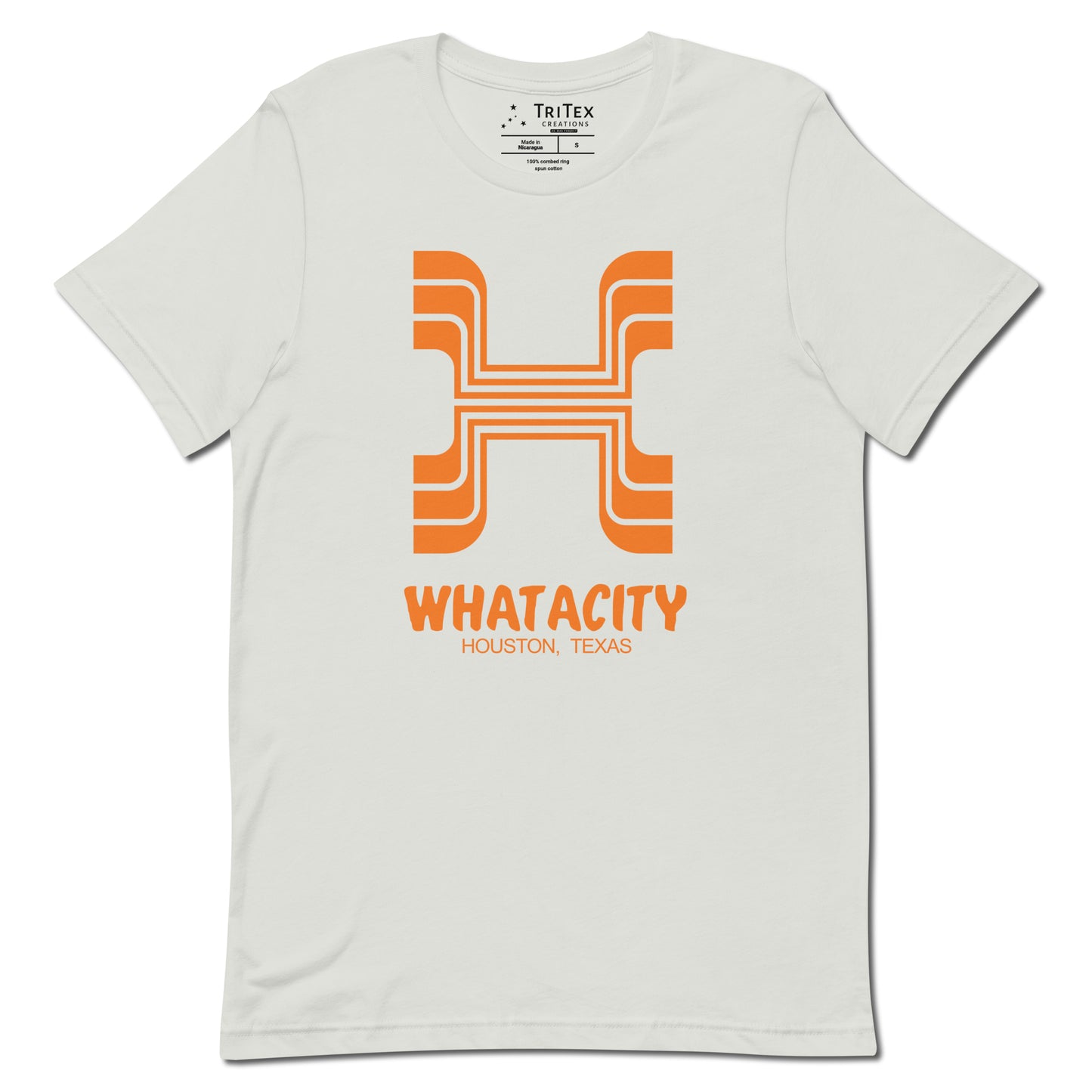 A silver t-shirt featuring a letter H style like the Whataburger logo with the text "Whatacity Houston, Texas".