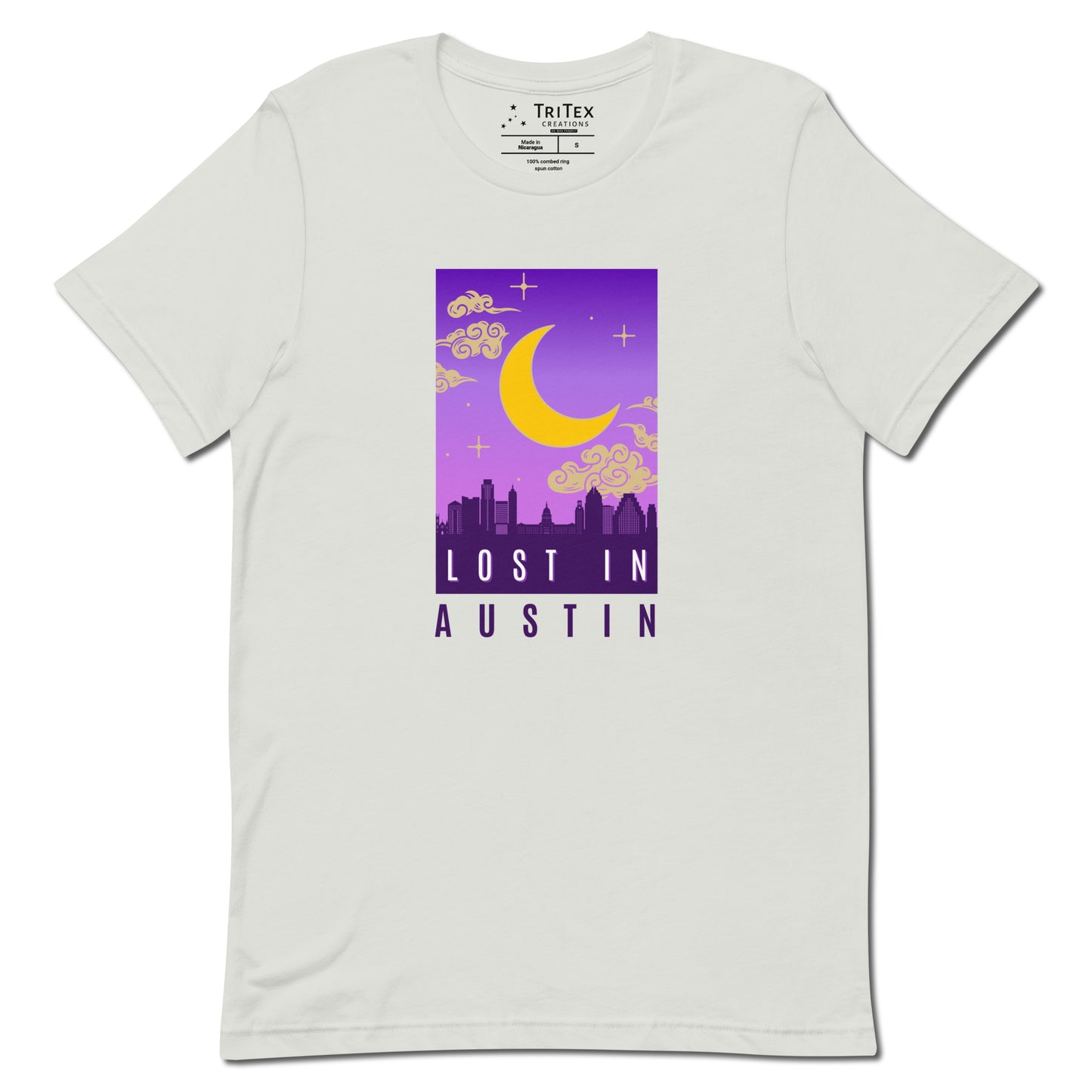 A silver t-shirt featuring the moon over the Austin skyline with the words "Lost in Austin".