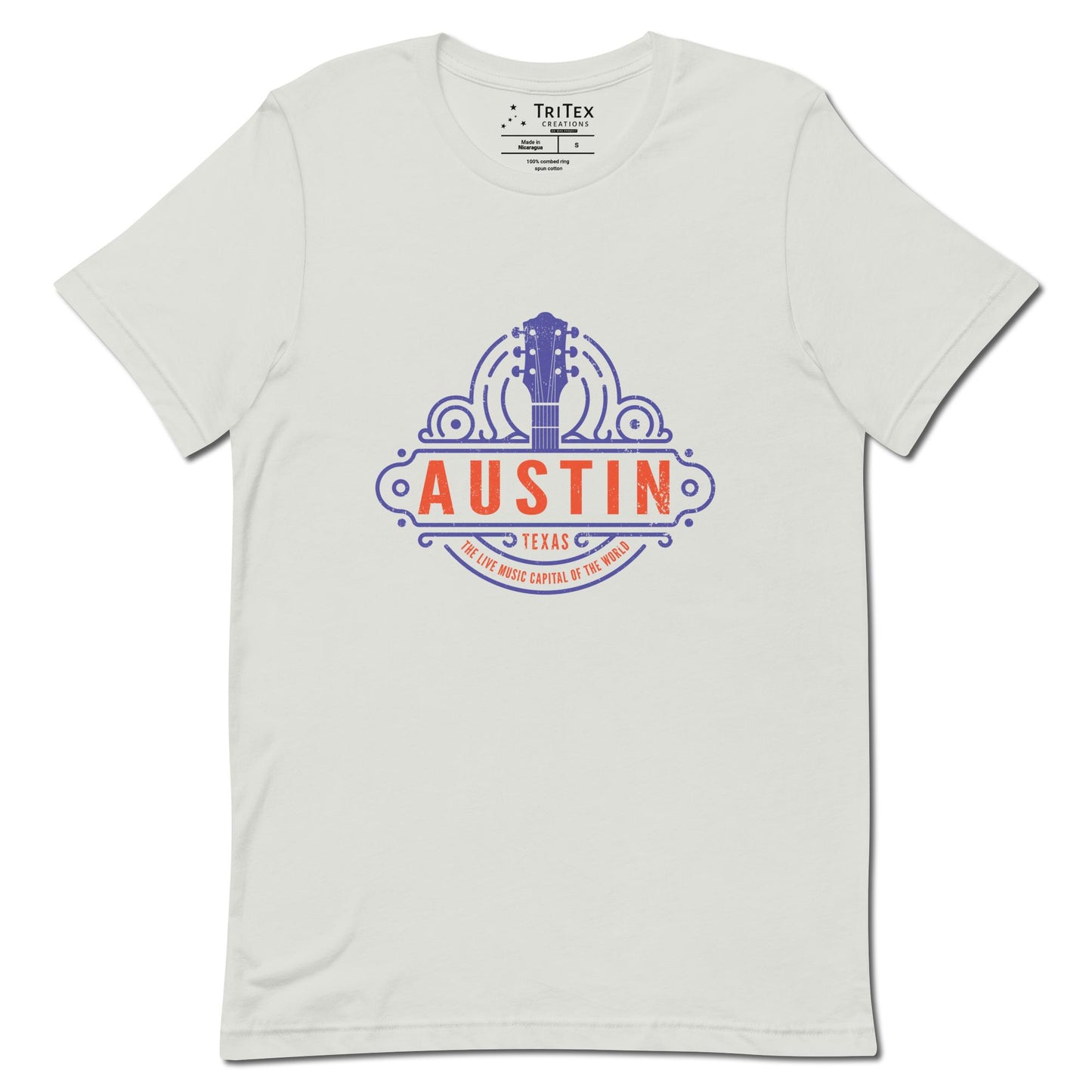 A silver t-shirt featuring the head and neck of a guitar with the words "Austin Texas. The Live Music Capital Of The World."