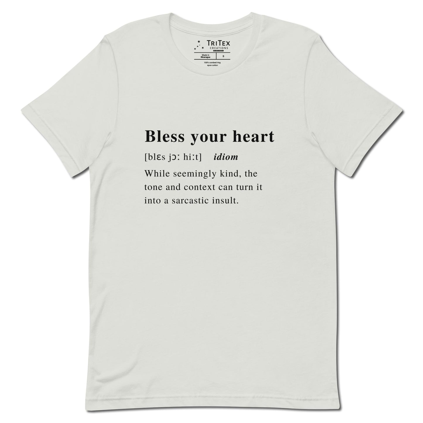 A silver t-shirt with the definition of "Bless your heart" styled like a dictionary entry