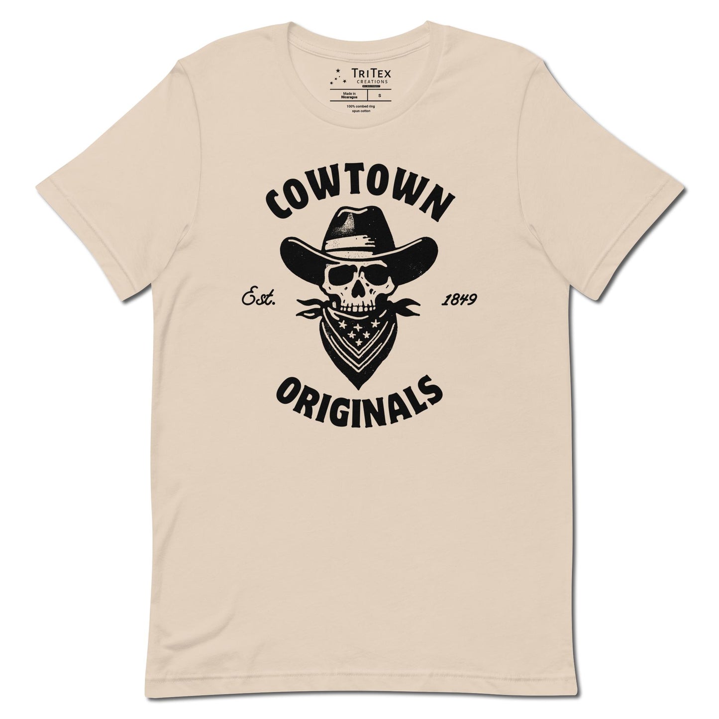 A soft cream t-shirt with an image of a  skull in a cowboy hat and kerchief which reads "Cowtown Originals Est. 1849".