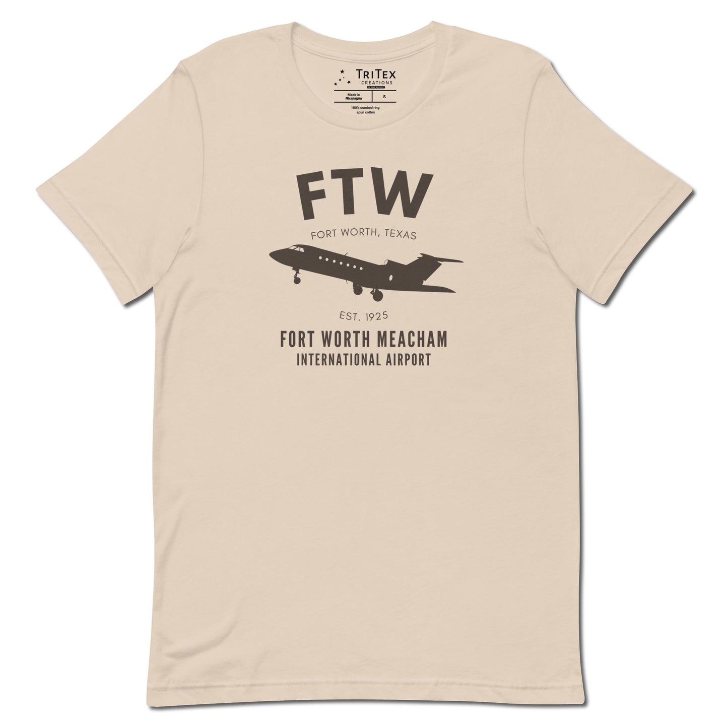 A soft cream t-shirt featuring a small passenger jet with the words "FTW Fort Worth, Texas Est. 1925. Fort Worth Meacham International Airport".