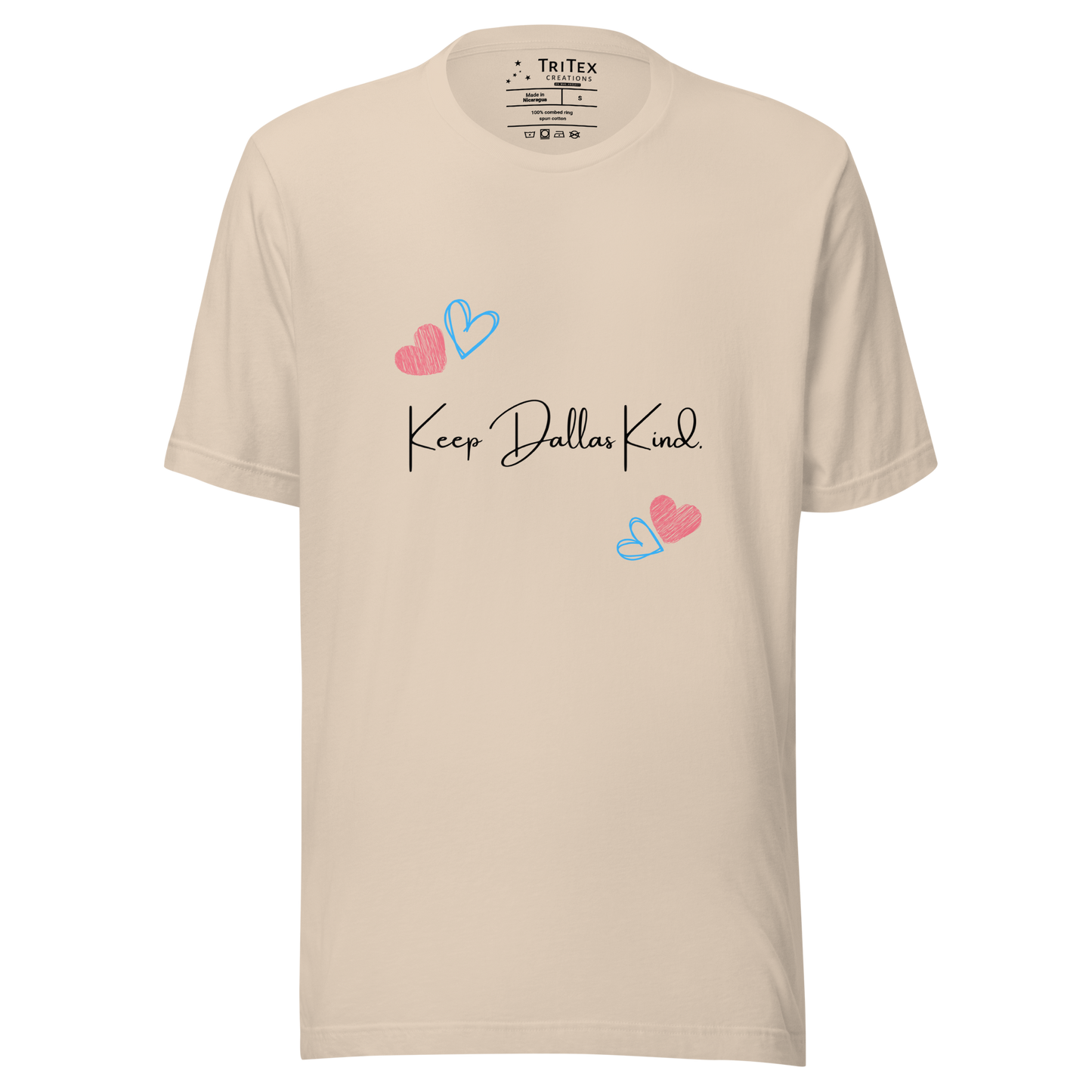 A soft cream t-shirt with hearts and the text "Keep Dallas Kind".
