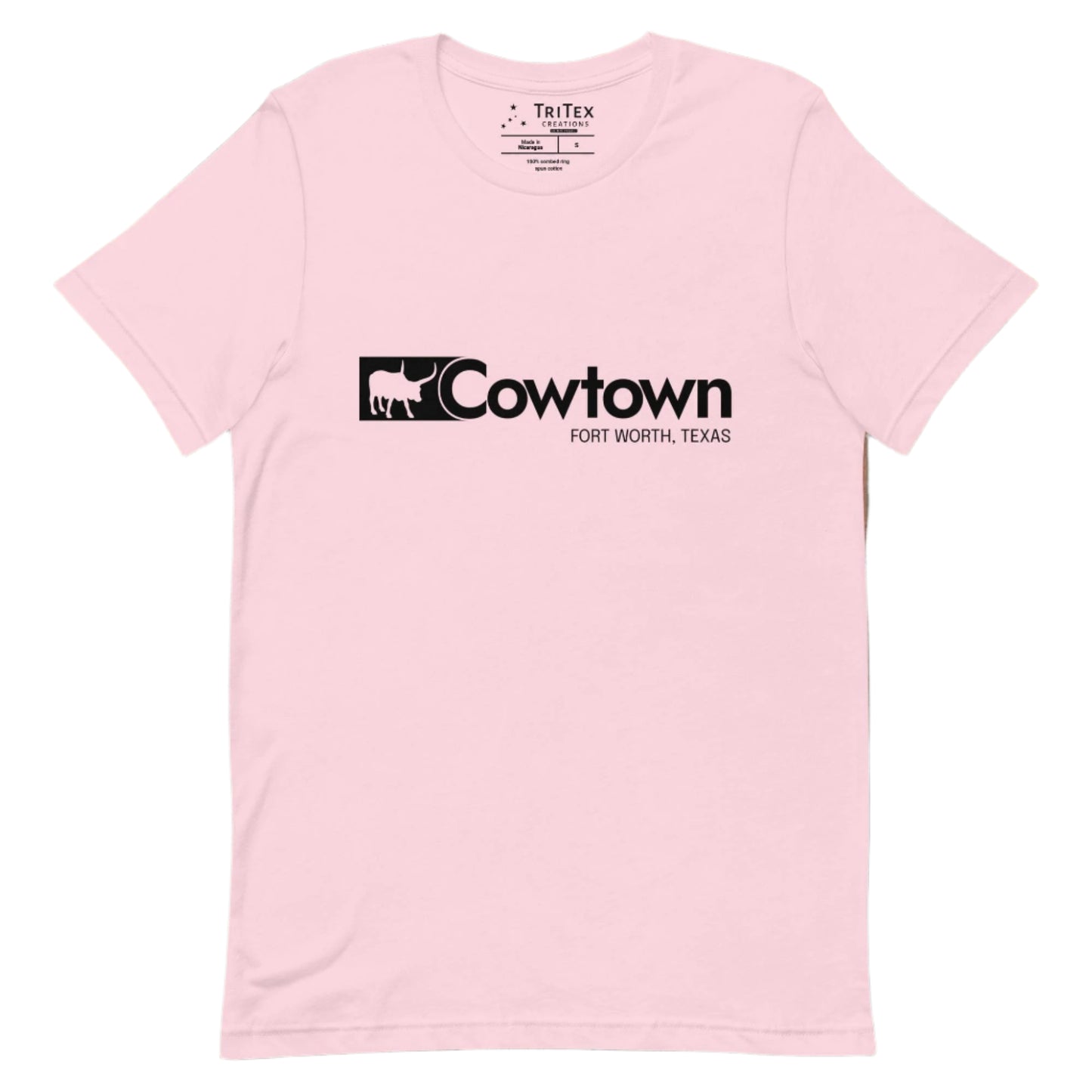 A soft pink t-shirt which reads "Cowtown Fort Worth, Texas" in the style of the Wrangler logo.