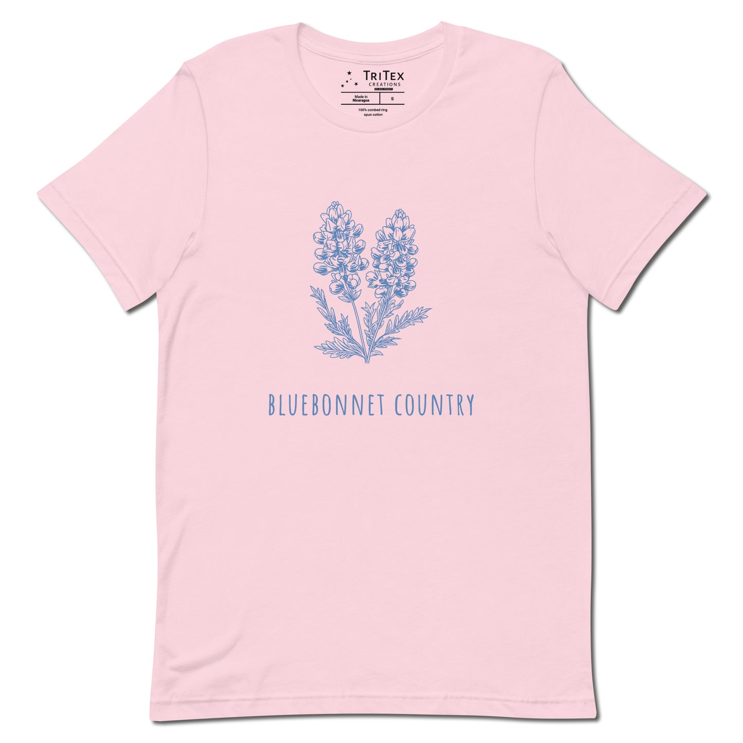 A soft pink t-shirt featuring an image of a bluebonnet flower with the words "Bluebonnet country" underneath.