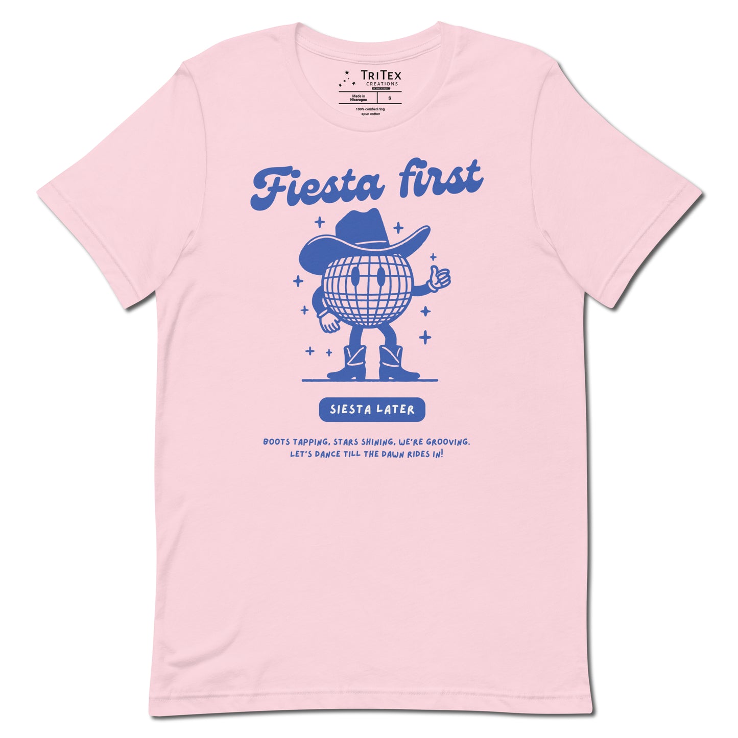 A soft pink t-shirt featuring a cartoon disco ball with arms, legs and a cowboy hat with text that reads: "Fiesta First, Siesta Later. Boots tapping, stars shining, we're grooving. Let's dance till the dawn rides in!".