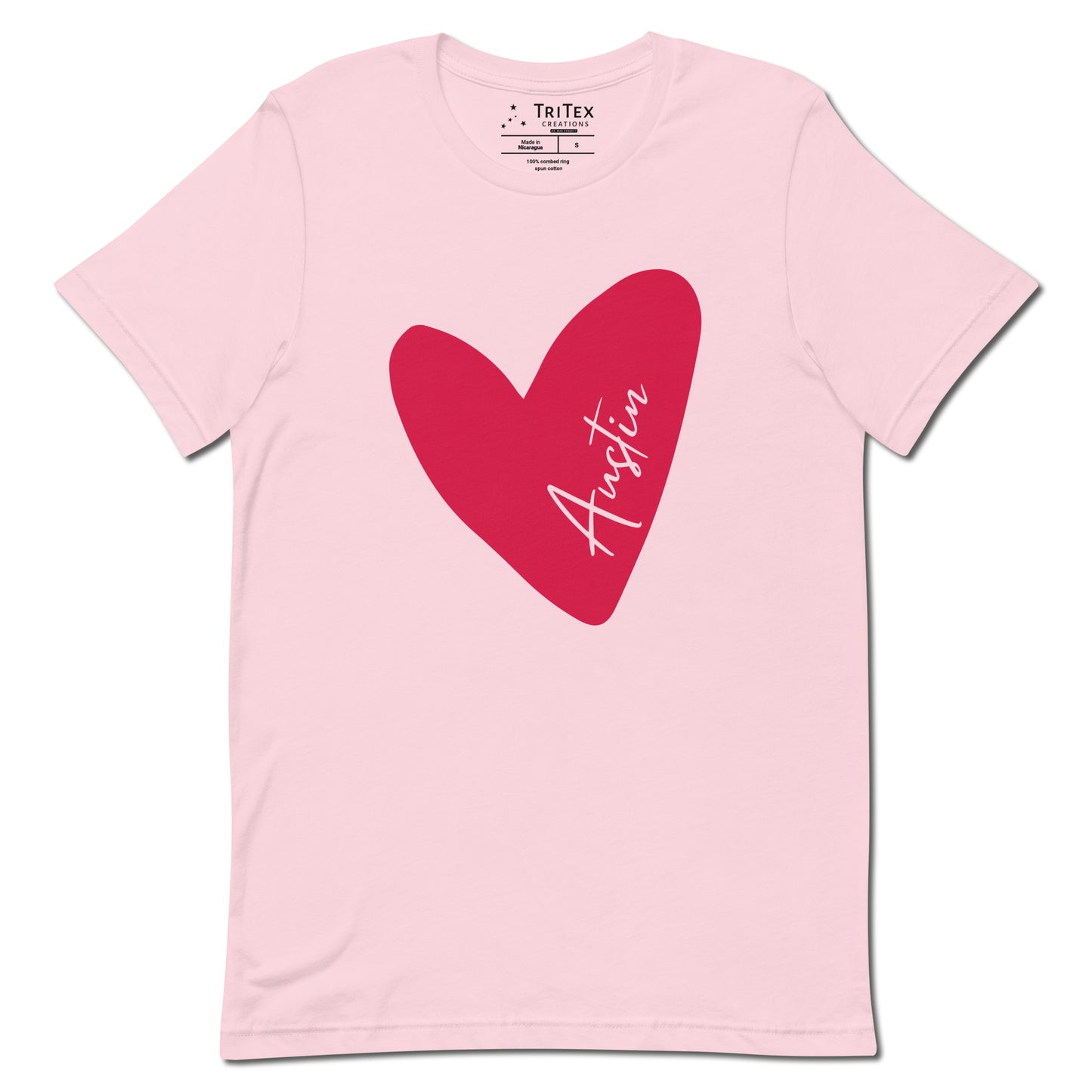 A soft pink t-shirt featuring a heart with Austin written in it.