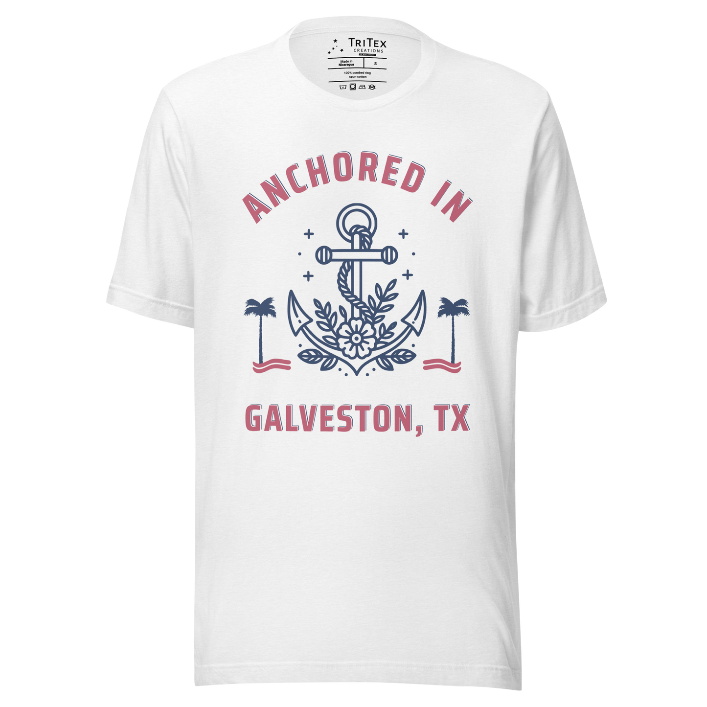 A white t-shirt featuring an image of an anchor, palm trees and a flower with the text "Anchored in Galveston, TX".