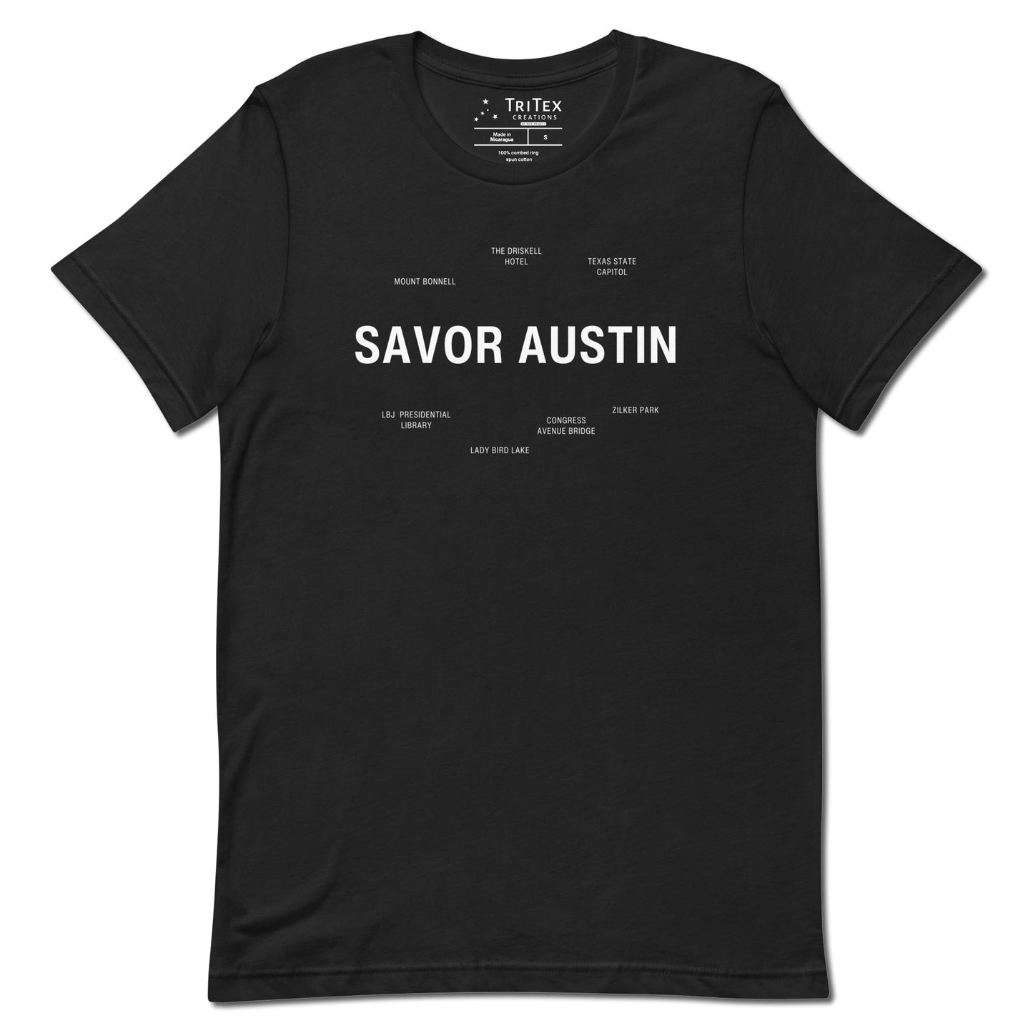 A vintage black t-shirt which reads "Savor Austin" in big, bold text with smaller text elements naming Austin's landmarks.