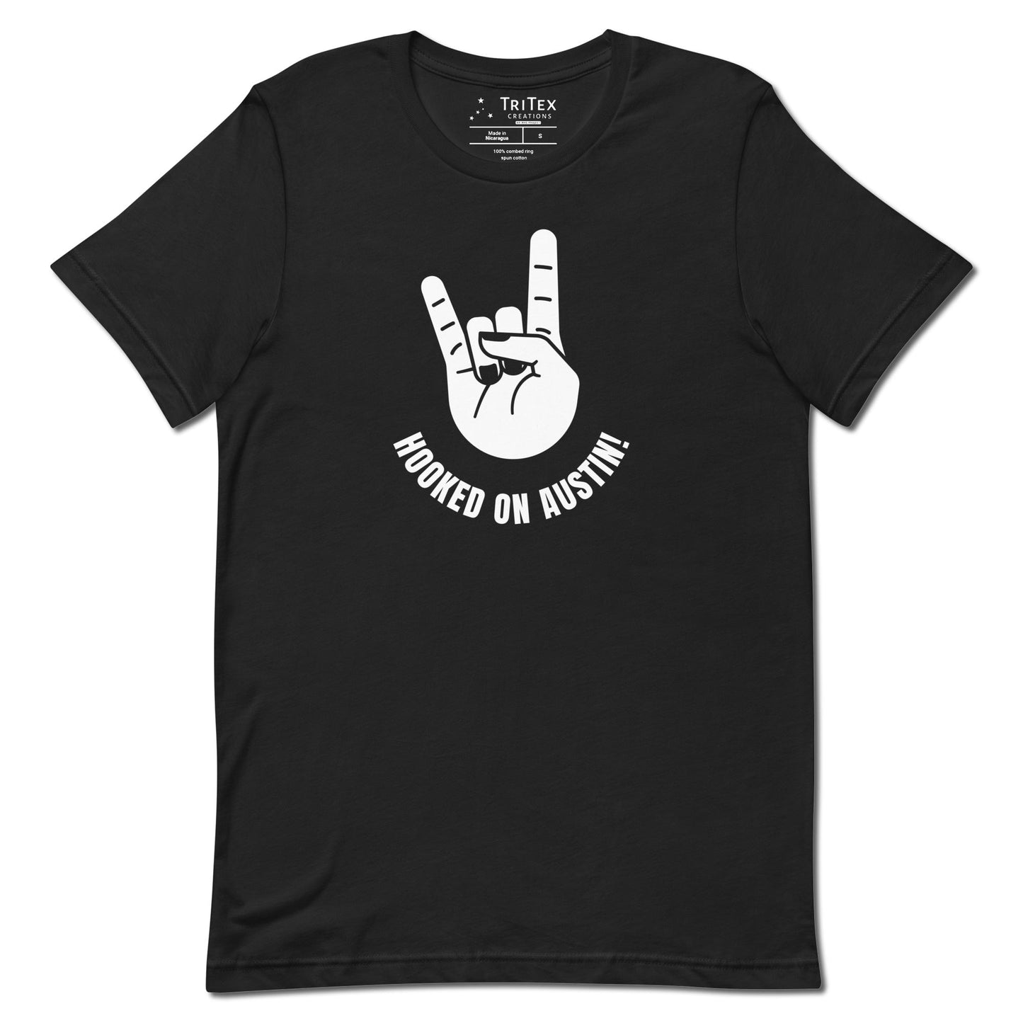 A vintage black t-shirt with a picture of a hand showing "devils horns" with the words "Hooked on Austin!".