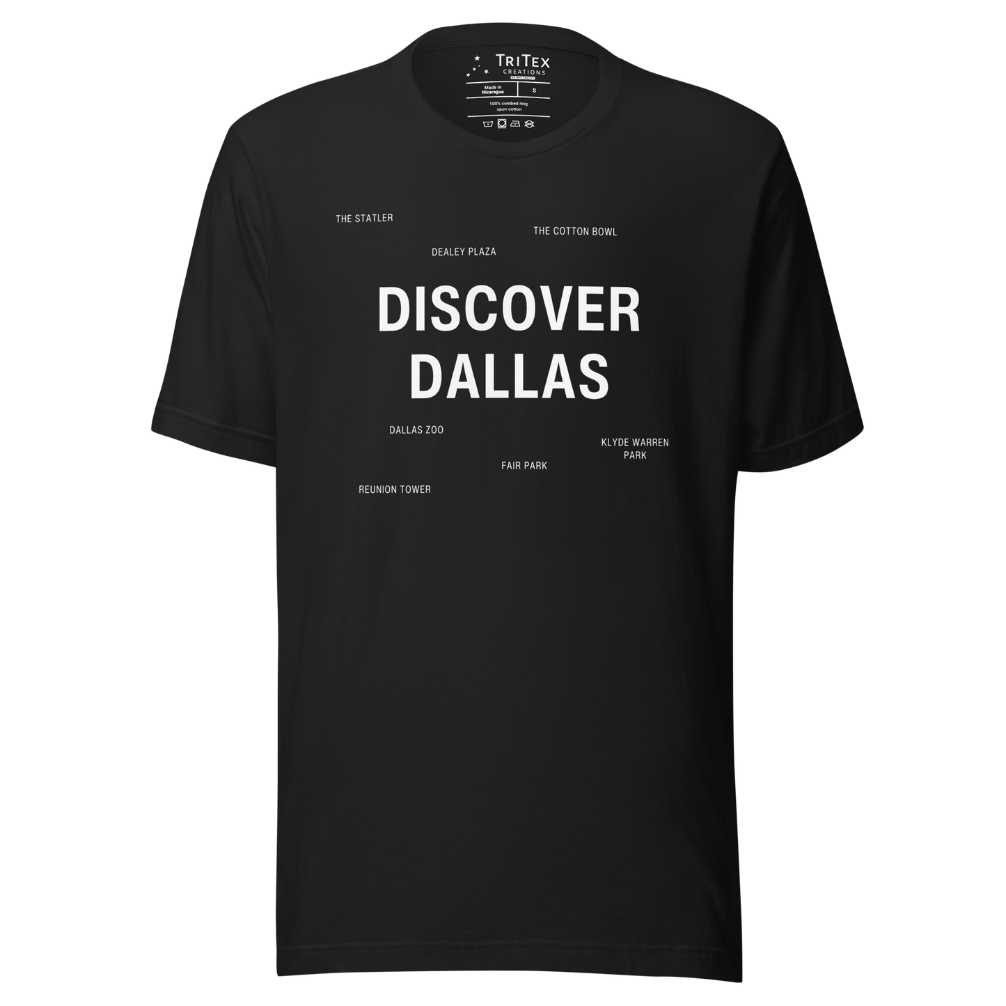 A vintage black t-shirt featuring "Discover Dallas" in big, bold type surrounded by smaller names of local landmarks.