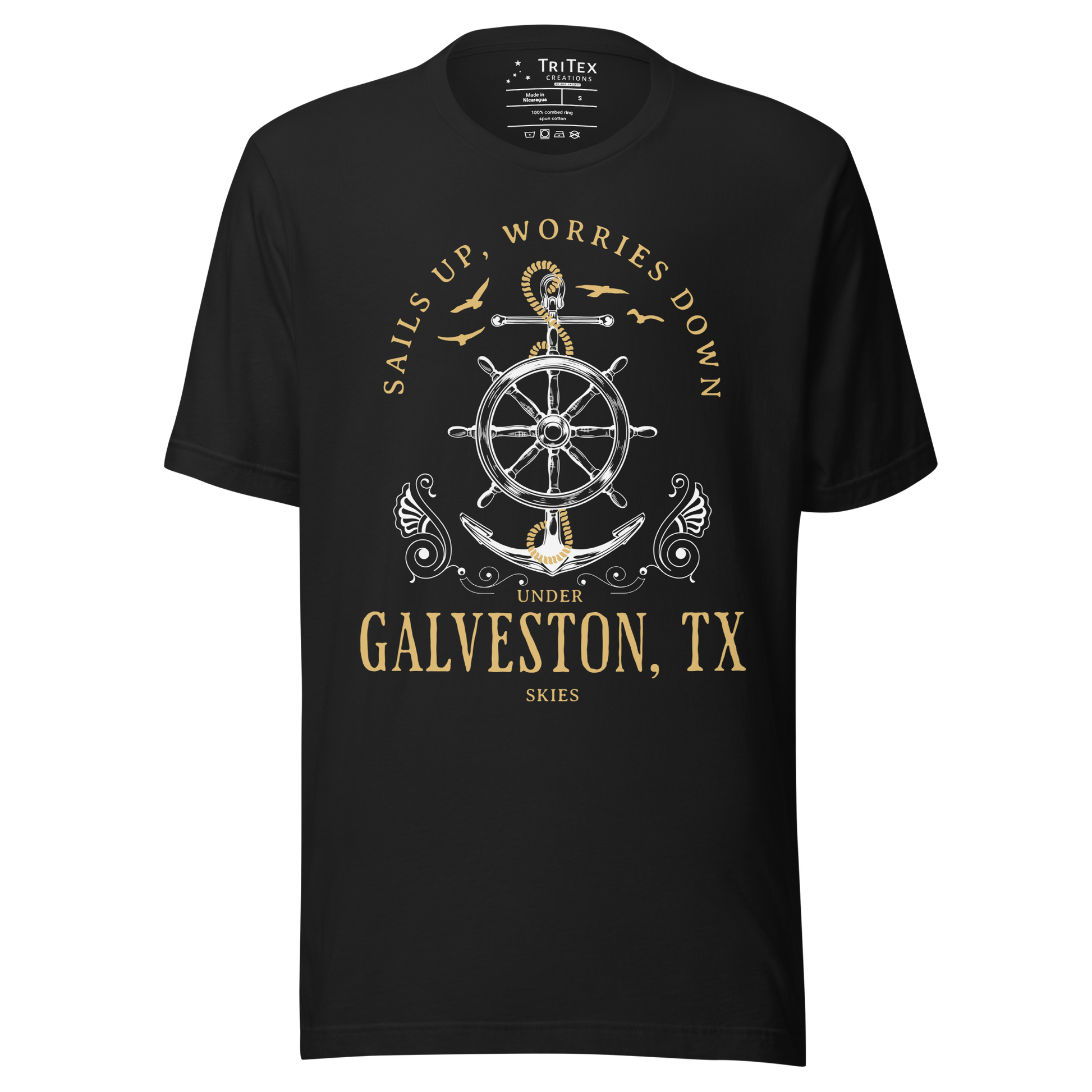 A vintage black t-shirt featuring an anchor and seagulls with the words "Sails up, worries down under Galveston, TX skies".
