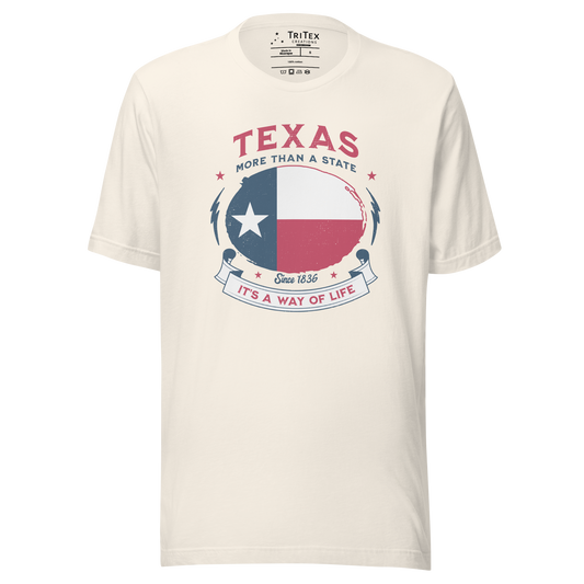 A vintage white t-shirt featuring the Texas flag with the text "Texas. More than a state. It's a way of life".