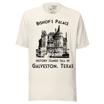 A vintage white t-shirt featuring a vintage-style picture of Bishop's Palace with the text "Bishop's Palace. History stands tall in Galveston, Texas".