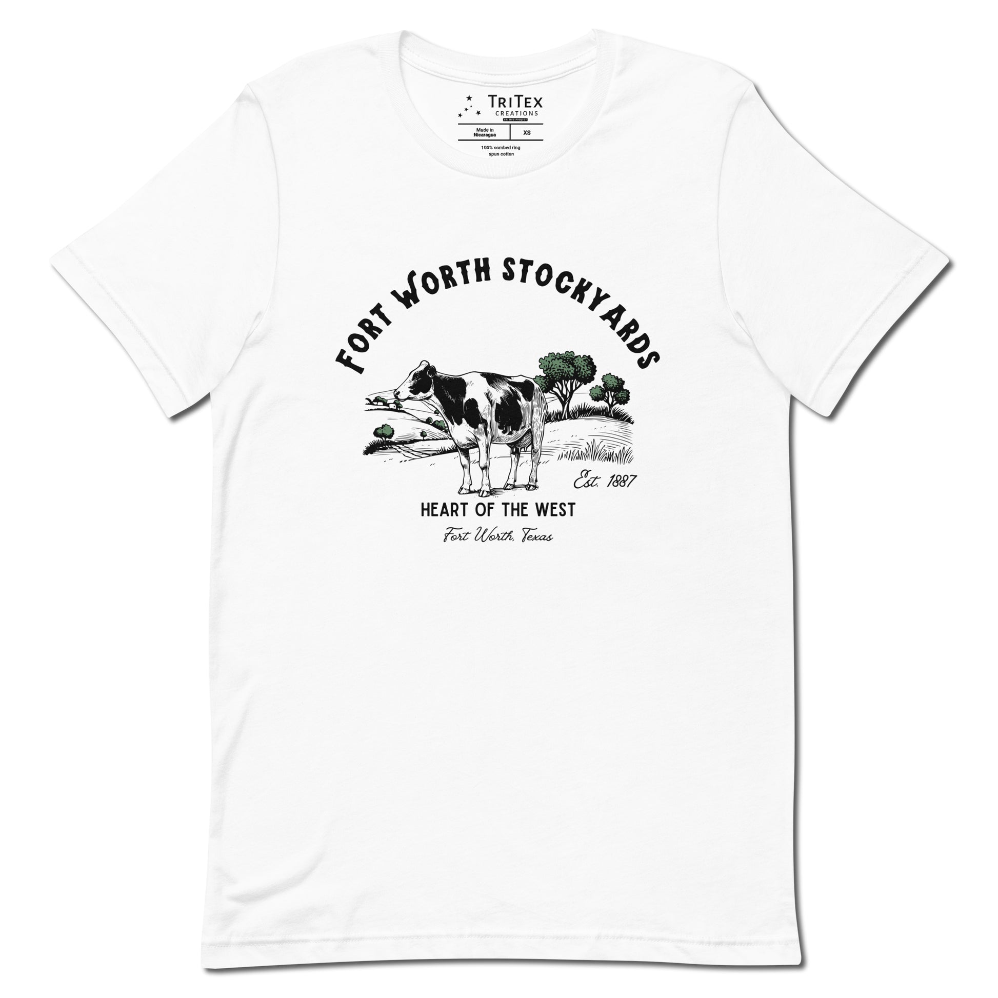 A white t-shirt with a black and white jersey cow stands in a field with trees and text that reads "Fort Worth Stockyards Est. 1887 Heart of the West Fort Worth, Texas".