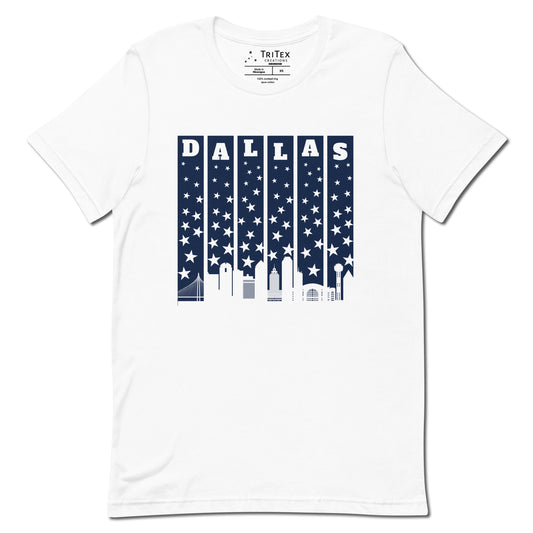 A white t-shirt with with the silhouette of the Dallas skyline underneath some stars and the name "Dallas".