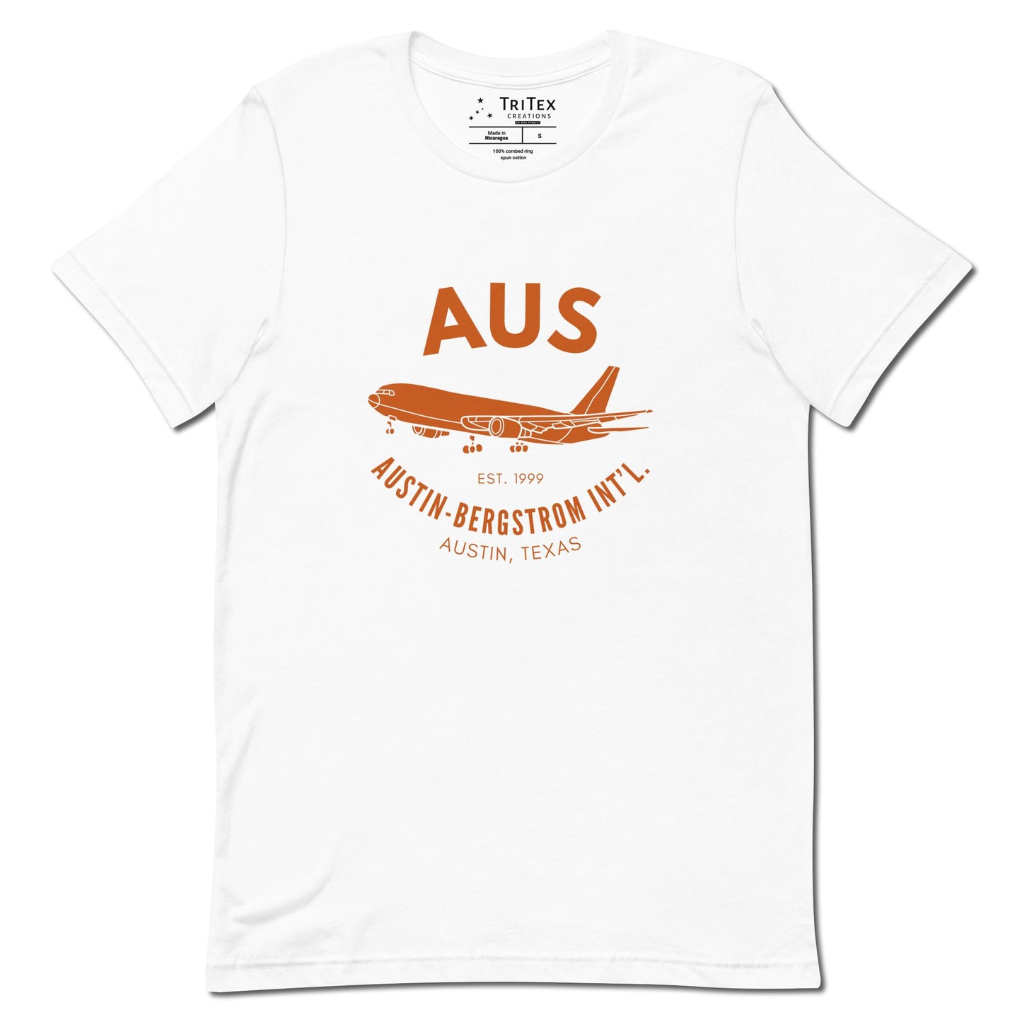 A white shirt featuring an image of an airplane with the words "AUS Est. 1999 Austin-Bergstrom Int'l. Austin, Texas".