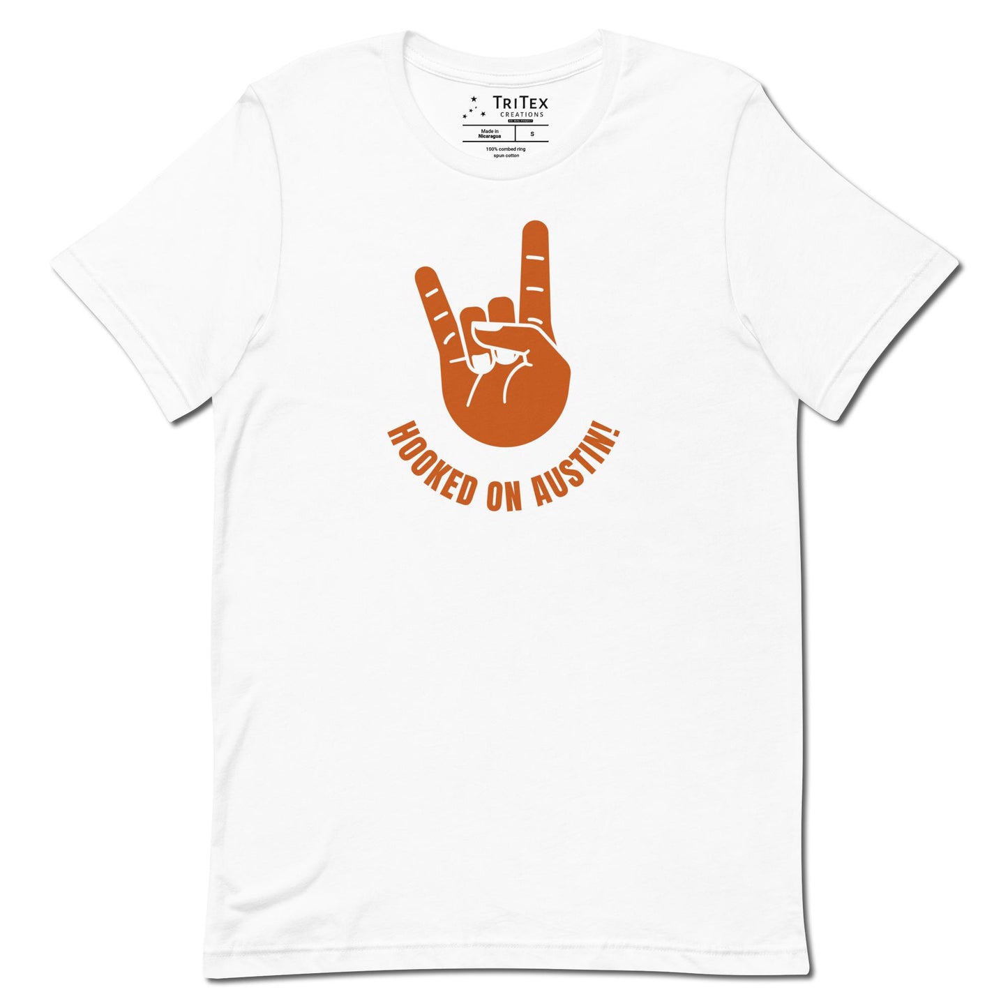 A white t-shirt with a picture of a hand showing "devils horns" with the words "Hooked on Austin!".