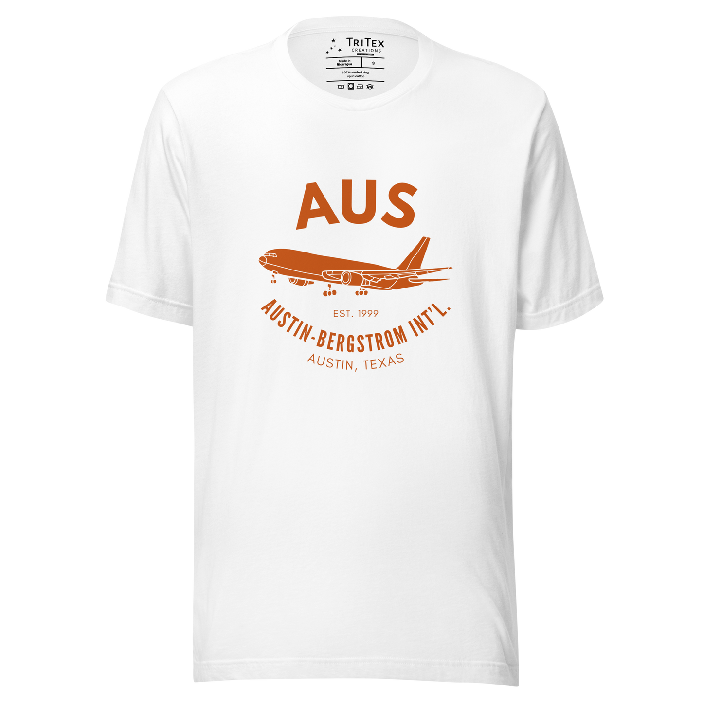 A white t-shirt with a silhouette of a passenger plane with the text "AUS Est. 1999 Austin-Bergstrom Int'l. Austin, Texas".